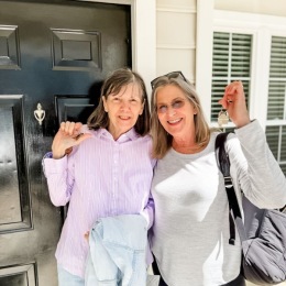 Welcome Home older ladies holding keys to new home