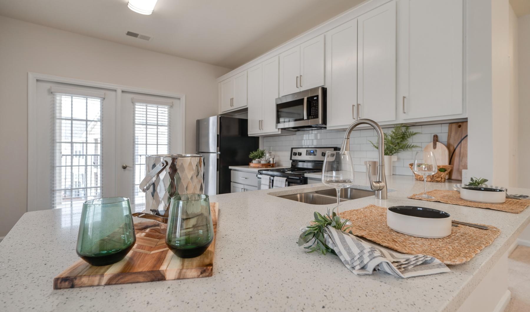 a kitchen with white cabinets