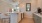 a kitchen with a table and chairs