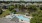 a pool surrounded by houses
