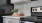 a kitchen with a stove and a plant on the counter