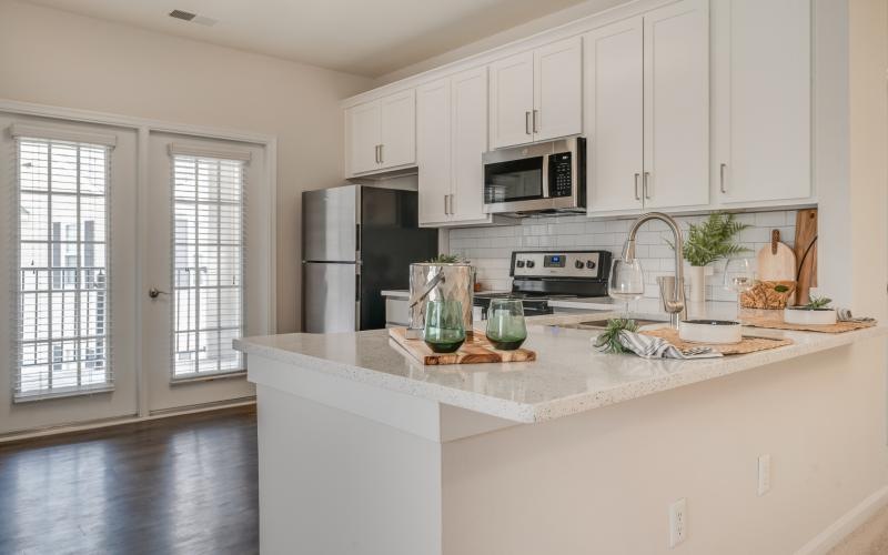 a kitchen with white cabinets