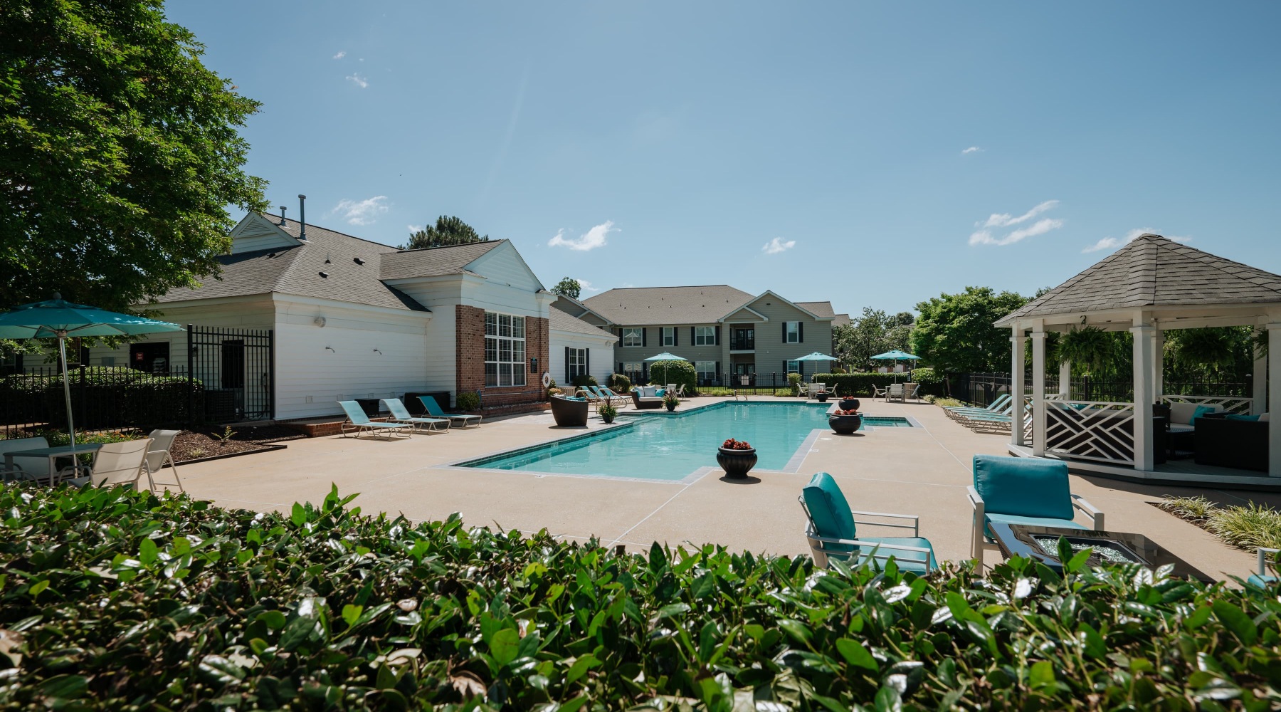 pool with spacious areas and lush landscaping